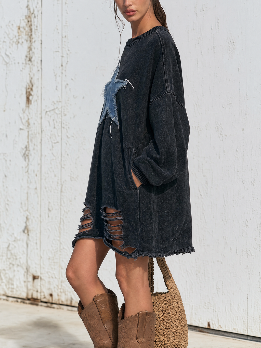 Ribbed crew neck and cuff detail on the washed black sweatshirt dress