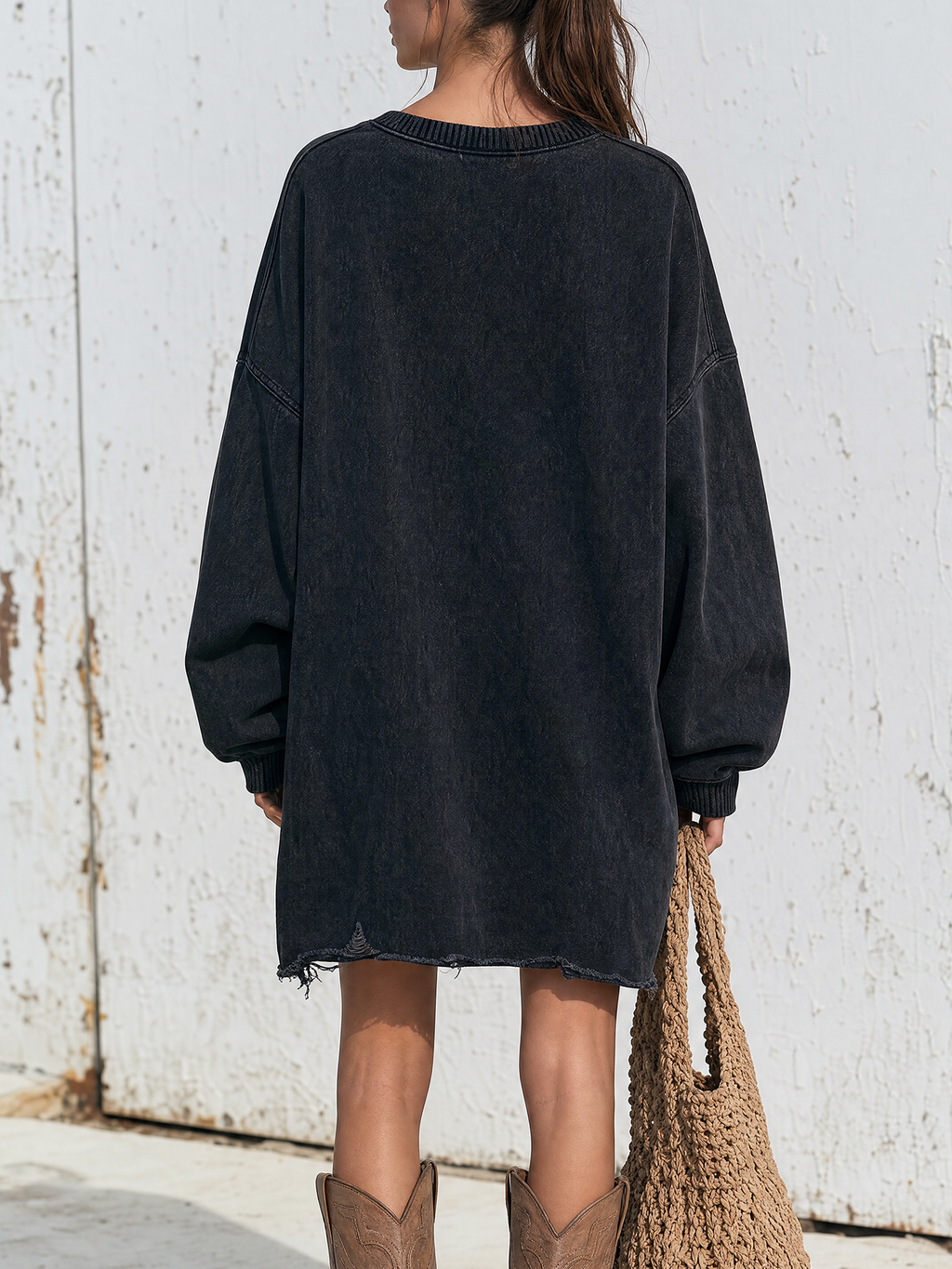 Side view showing the drop-shoulder oversized cut of the dress