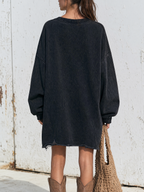 Side view showing the drop-shoulder oversized cut of the dress