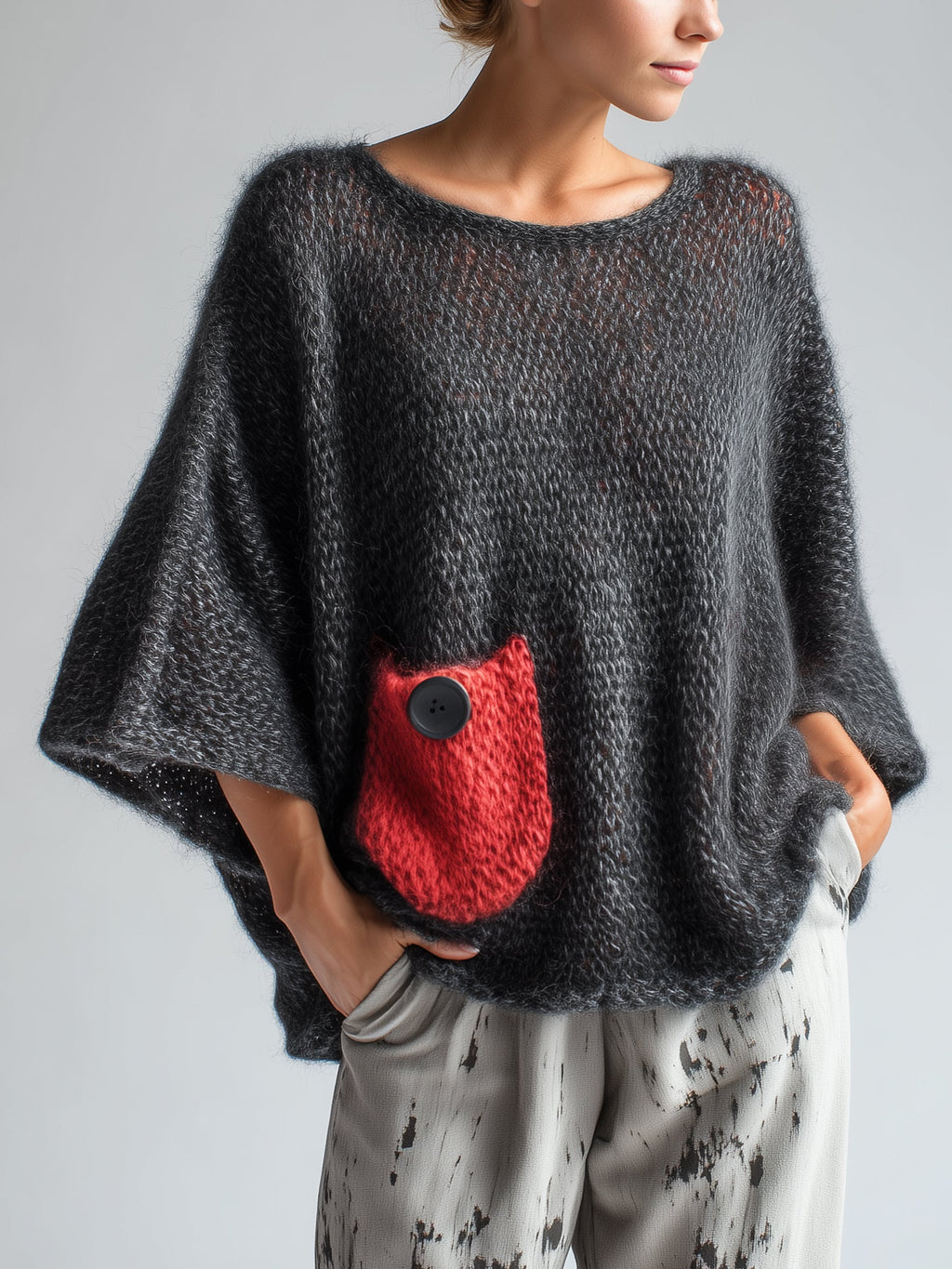 Oversized black wool blend sweater for women, front view on model