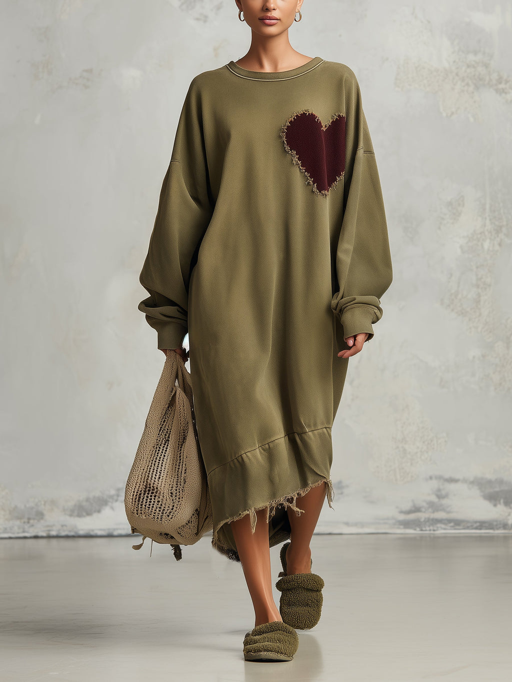 Oversized olive sweatshirt dress, midi length, front view on model