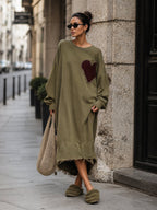 Distressed burgundy heart patch on the front of the olive dress