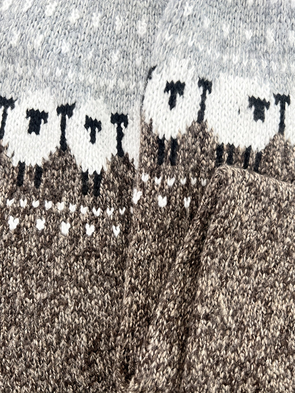 Sheep jacquard sweater detail at the sleeve and cuff
