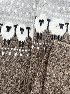 Sheep jacquard sweater detail at the sleeve and cuff