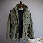 Men's M-65 field jacket in green, front view on model