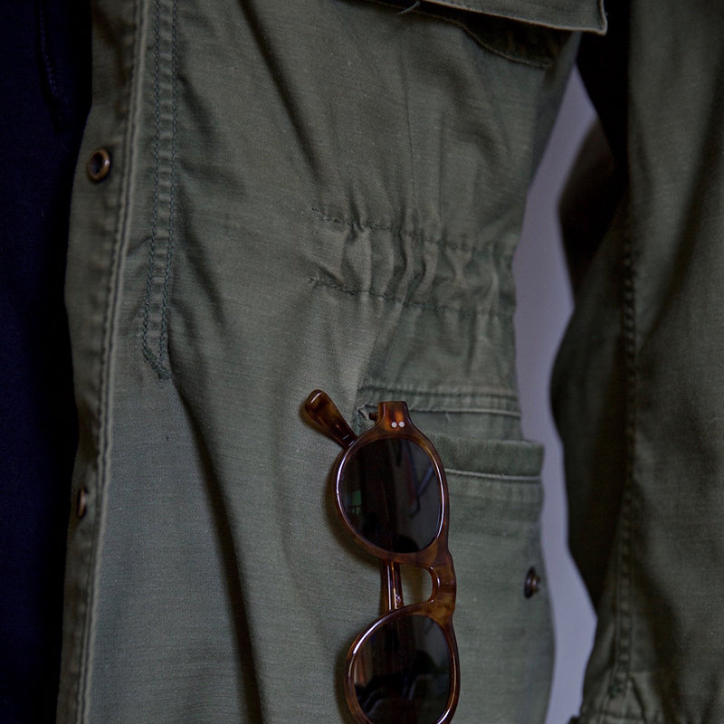 M-65 field jacket showing the four front pockets and zip front