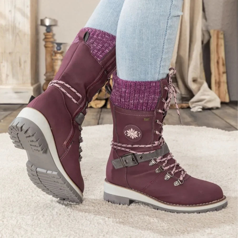 Winter boots worn on wet ground showing the water-repellent upper