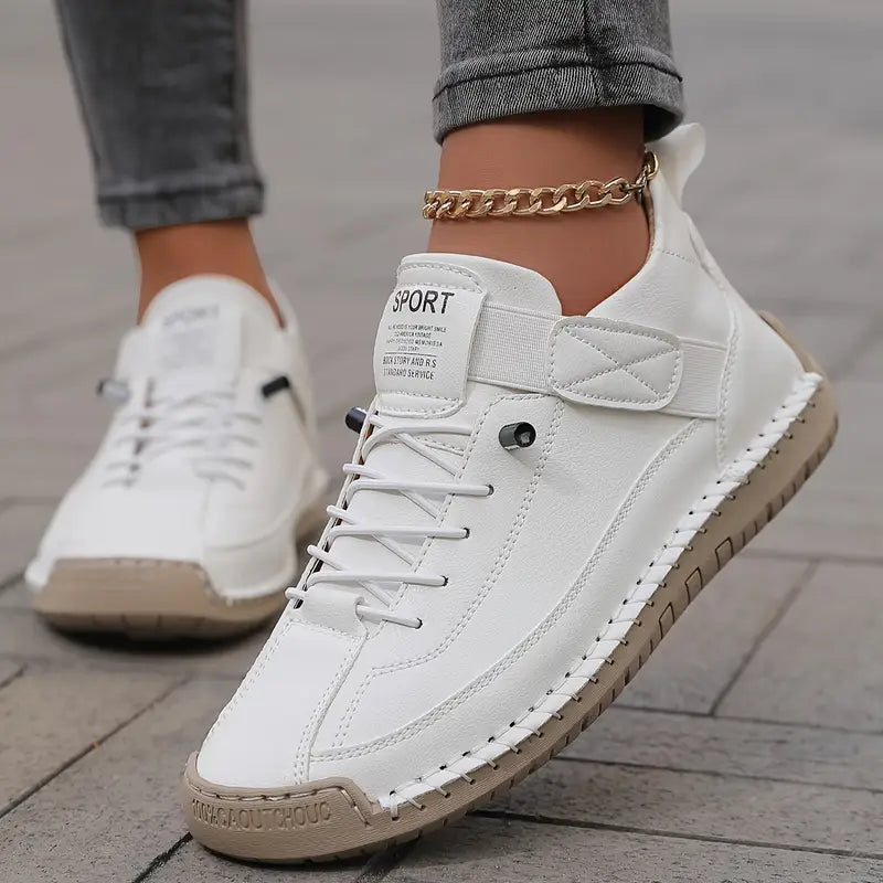 Women's orthopedic slip on sneakers in white, pair shown together