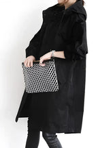 Drawstring hood detail on the women's waterproof raincoat