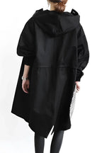 Elastic cuff detail at the sleeve of the hooded raincoat