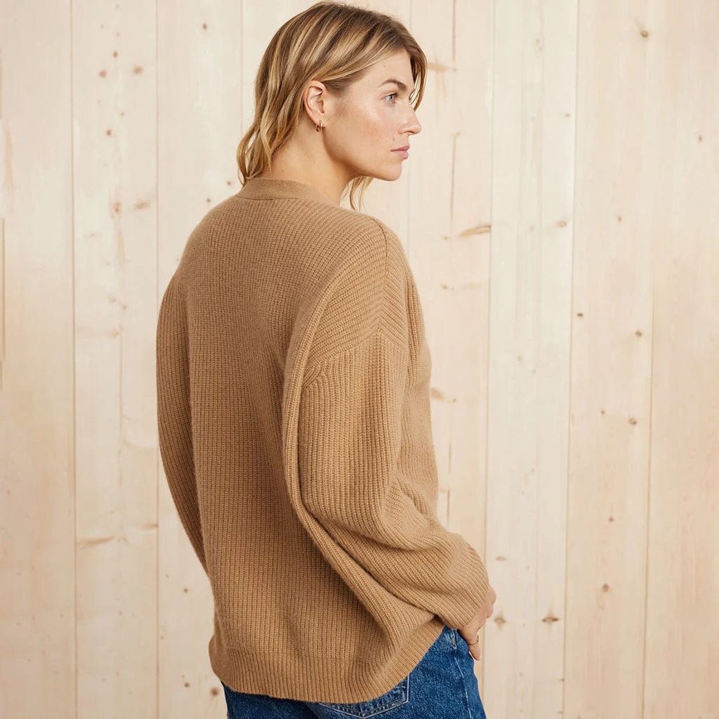 Camel cashmere cardigan, three-quarter view showing the relaxed drape