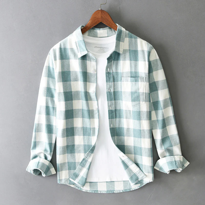 Plaid cotton shirt shown from the side with the curved hem