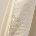 Men's lambswool sweater vest — side view on model