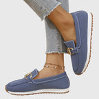 Low vamp detail on a beige faux leather loafer for women