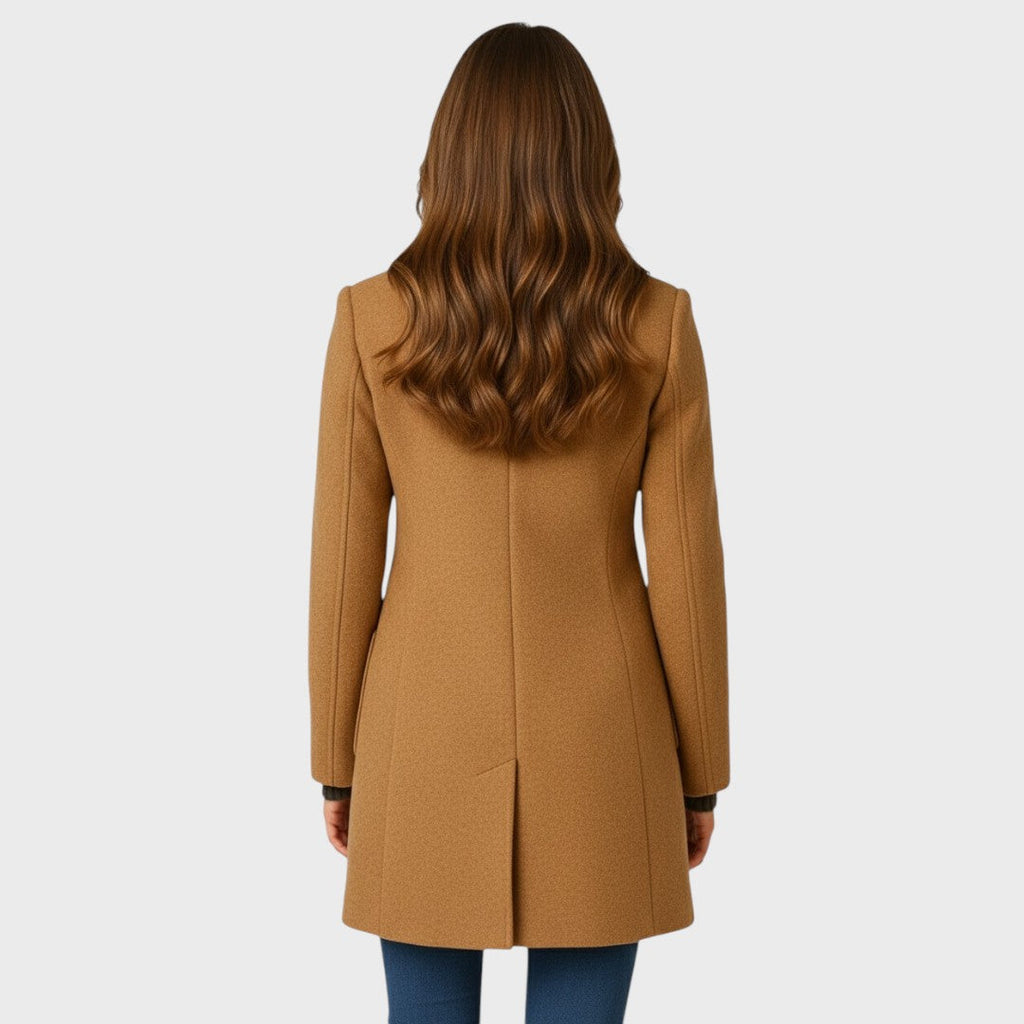 Close view of the funnel neck stand collar on the tailored long coat