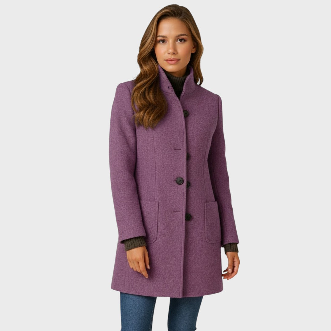 Tailored long coat for women styled outdoors in a dark colorway