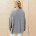 Heather grey cashmere cardigan, side view on model