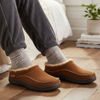 Side profile of the moccasin house slipper showing the stitched upper
