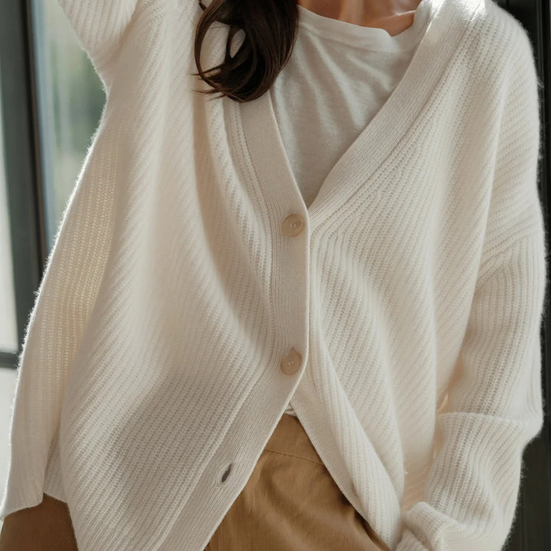 Cashmere cardigan in ivory, worn open with a long line