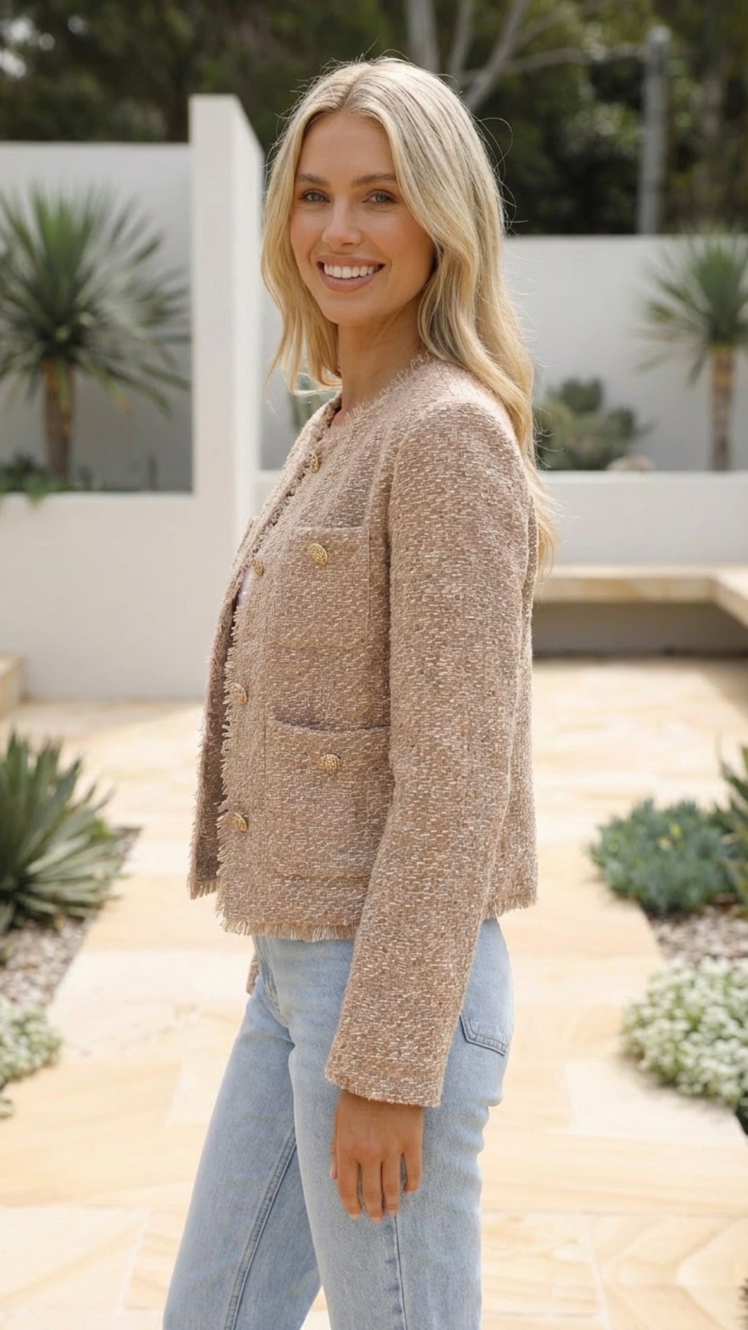 Women's cropped jacket in beige seen from the side