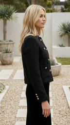 Women's cropped jacket in black seen from the side