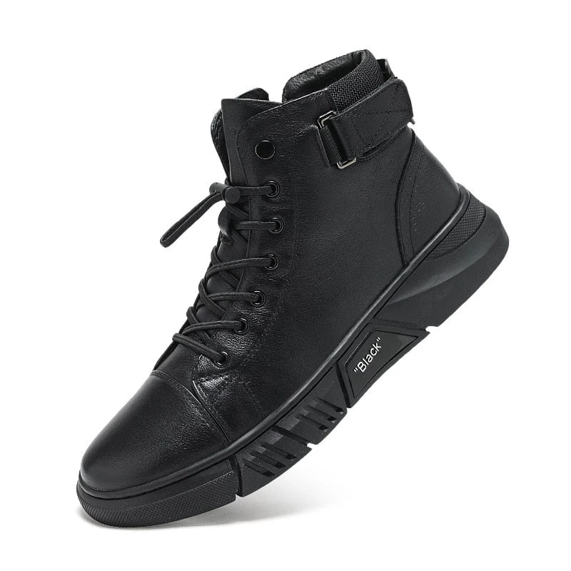 Men's black walking shoes worn with trousers on a hard floor