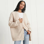 Cashmere cardigan in oatmeal, flat view of the knit