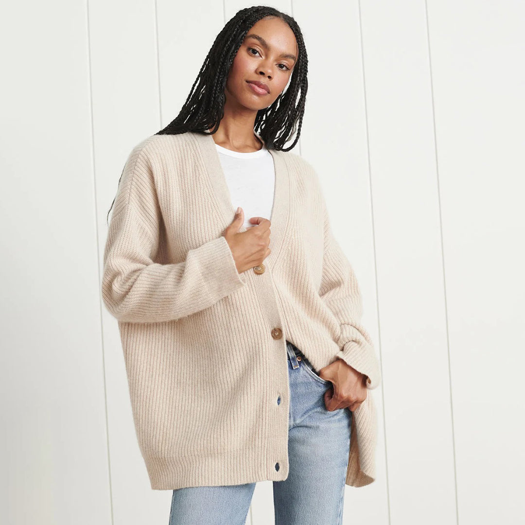Cashmere cardigan in oatmeal, flat view of the knit