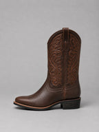 Pair of brown embroidered western boots for women worn with denim