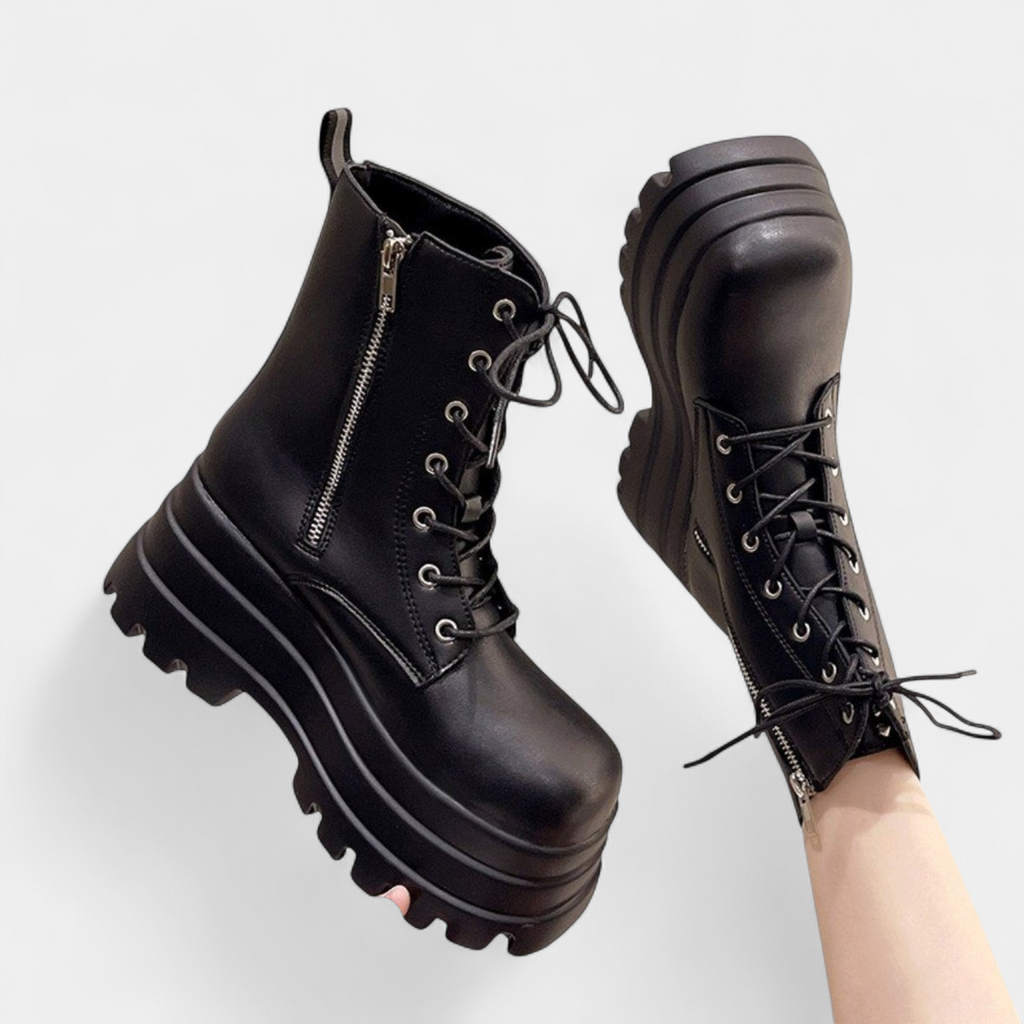 Lace-up front of the black faux leather combat boot