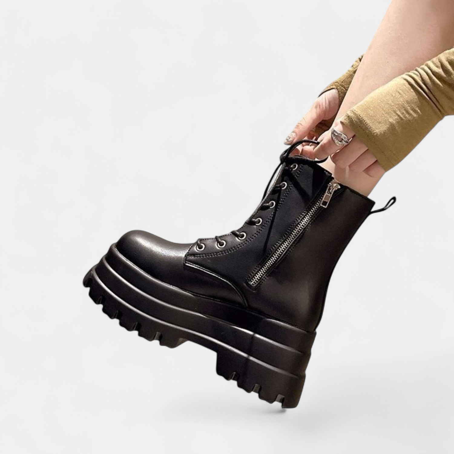 Deep tread outsole and chunky ankle-height silhouette, rear view