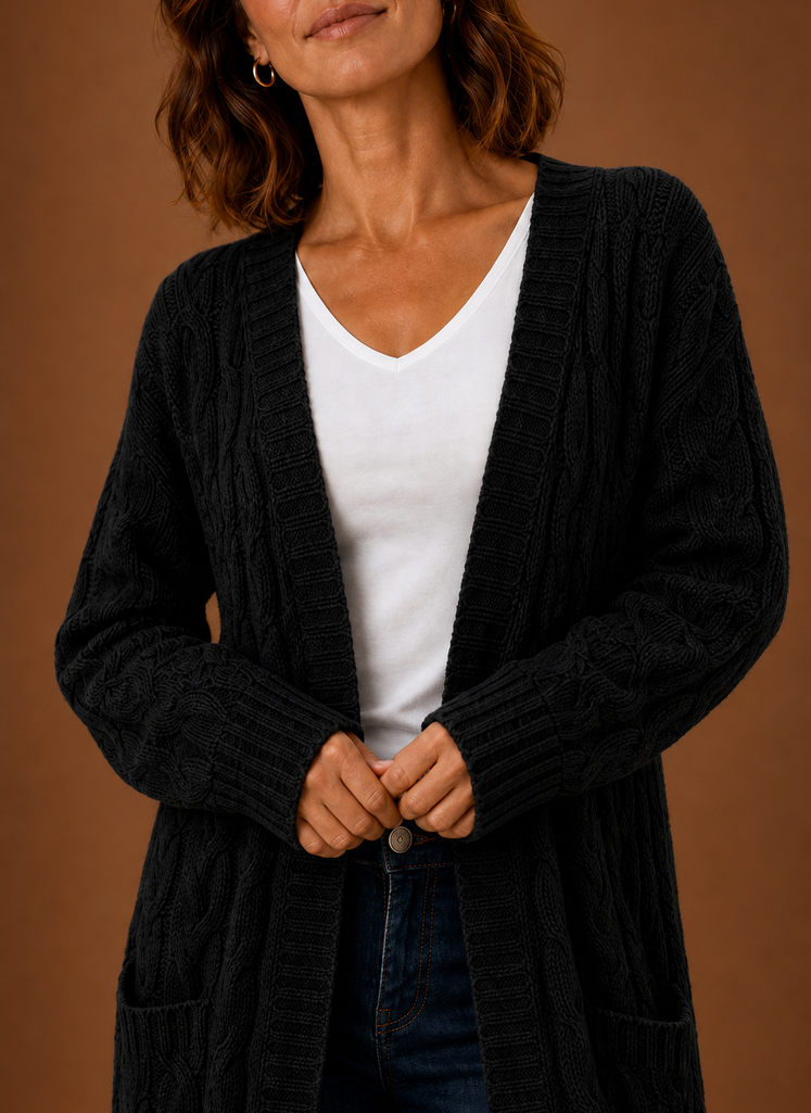 Close-up of the ribbed cuff and cable stitch in black