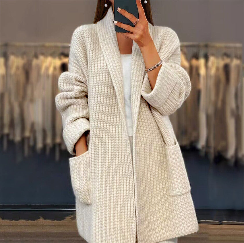 Open front cardigan sweater in beige, worn open with pockets visible
