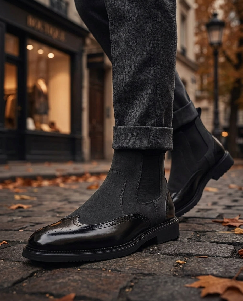 Suede Chelsea boots for men showing elastic side panel and perforated brogue trim