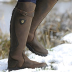 Close-up of the buckle strap across the boot shaft