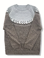 Close-up of the sheep jacquard motif knitted into the gray sweater