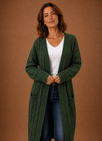 Hooded cable knit cardigan in green, front view