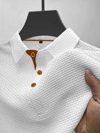 Men's knit polo shirt in white, front view on model