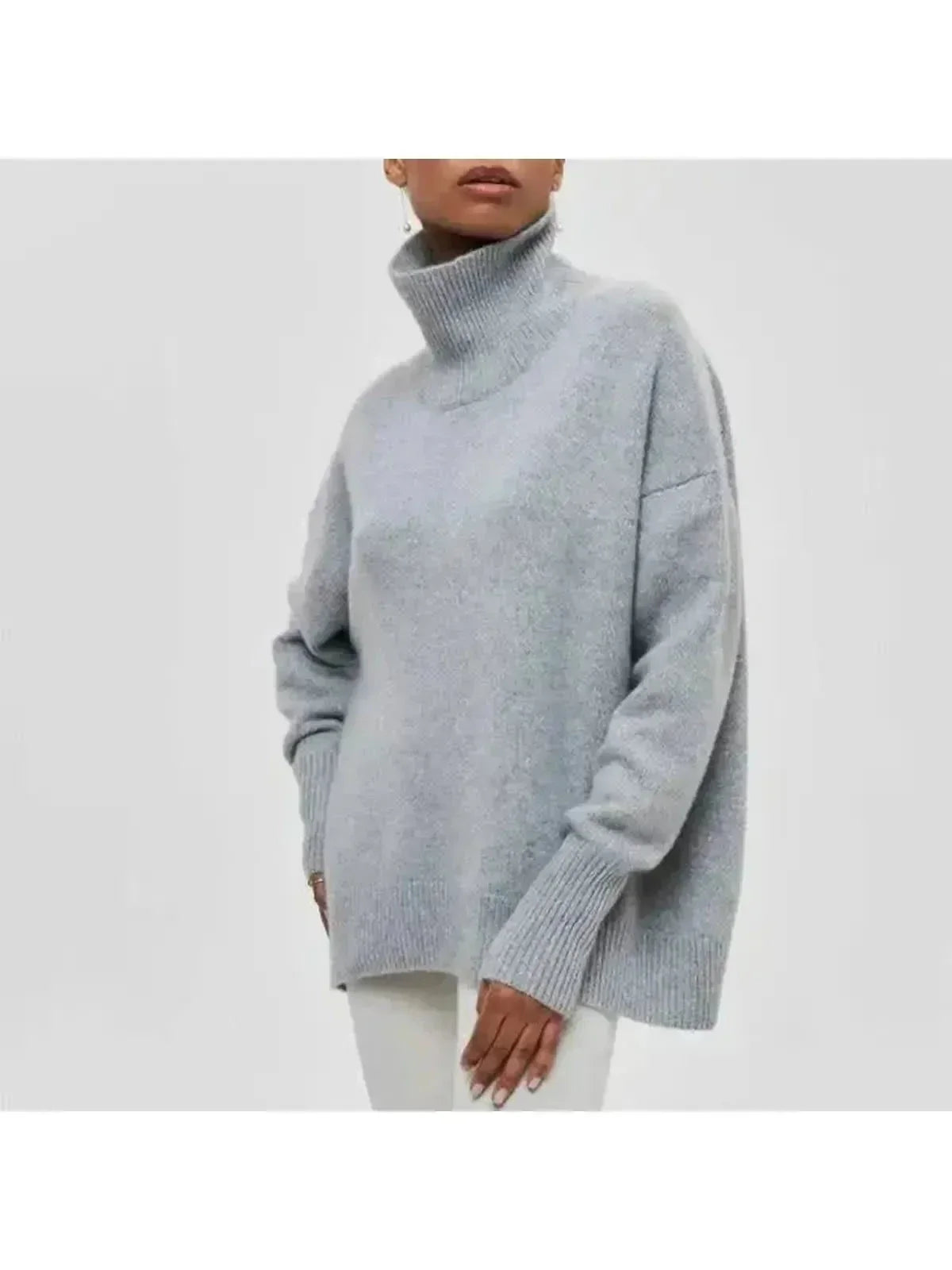 Side view of the chunky knit turtleneck showing the boxy fit