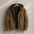 Men's sherpa lined canvas jacket in brown, front view on model
