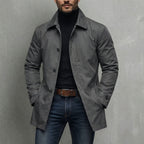 Men's windproof coat worn open over a hoodie