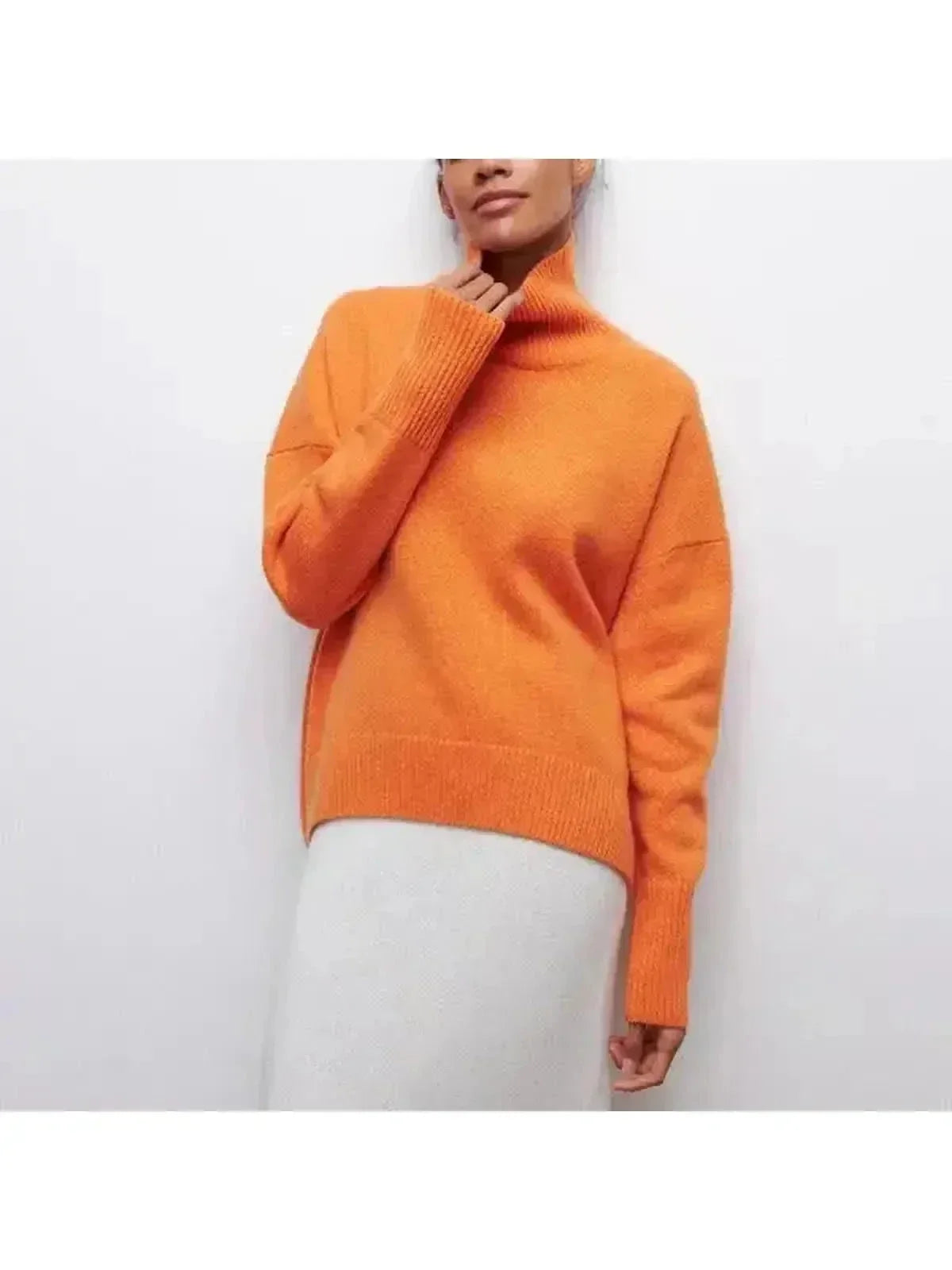 Oversized turtleneck sweater styled with trousers, full-length view
