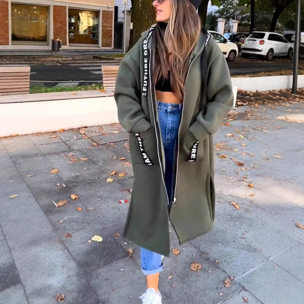 Duster coat in green, three-quarter view showing the drape