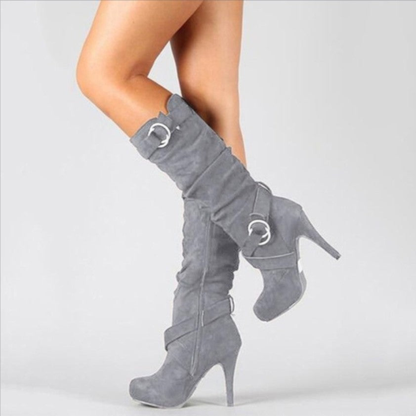 Stiletto heel knee high boots for women in black, side view with buckle straps