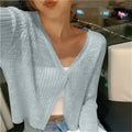 Lightweight ribbed button up cardigan in blue, front view