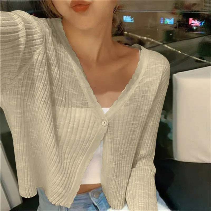 Lightweight ribbed button up cardigan in beige, showing the button front