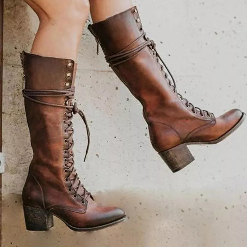 Combat boot in black, front view with pointed toe