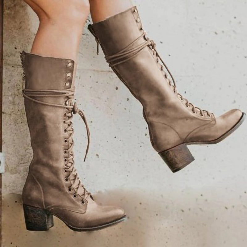 Block heel combat boots worn with denim, on-foot shot