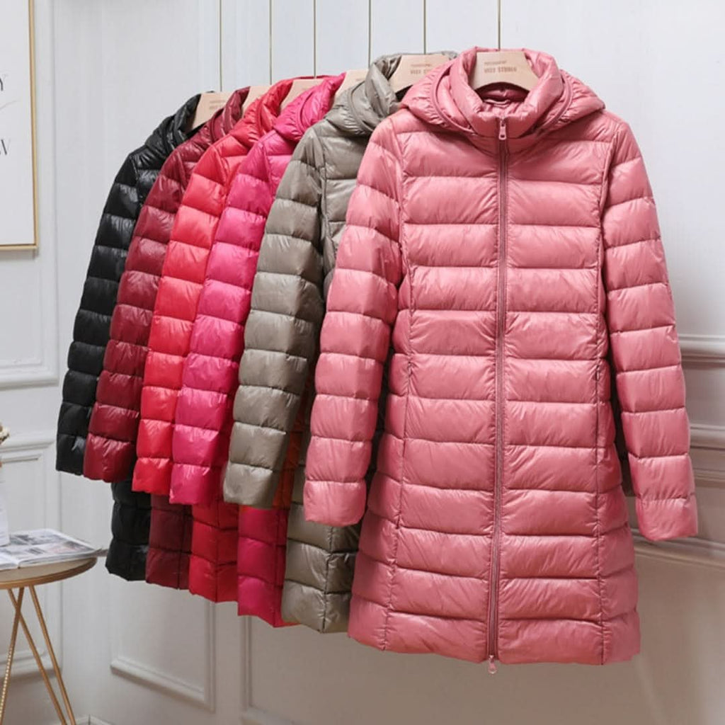 Lightweight down puffer jacket for women, longline fit worn with the hood up