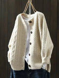 Oversized cable knit cardigan sweater — front view on model